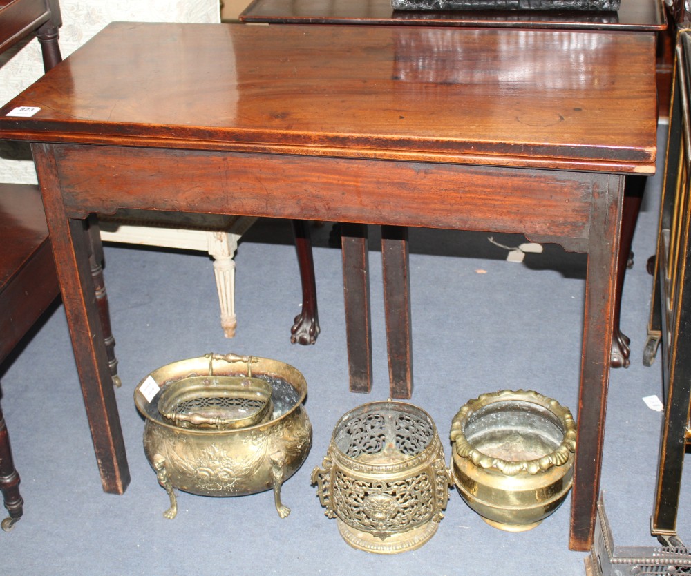 A George III mahogany folding top tea table, with chamfered legs, W.95cm D.45cm H.74cm